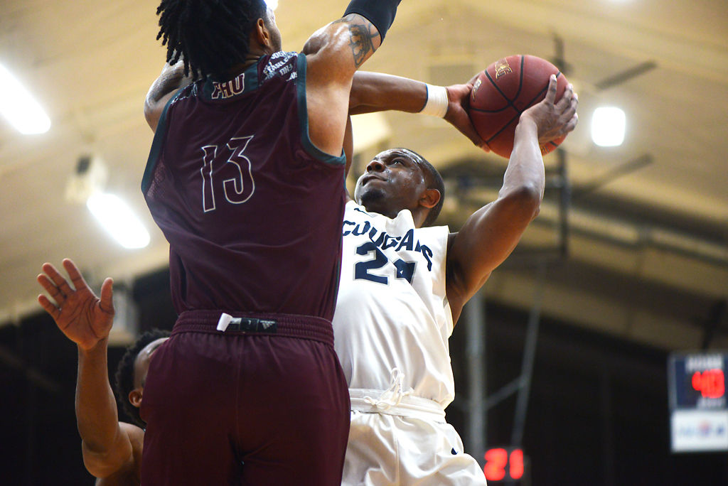 Justin Shaw goes up for a basket against Freed-Hardeman